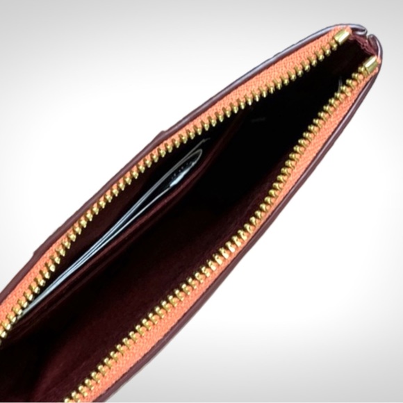 Coach Corner Zip Wristlet in Signature
Canvas Tan with Coral Stripe - Picture 4 of 5